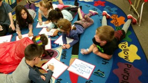 practicing handwriting on the white boards.